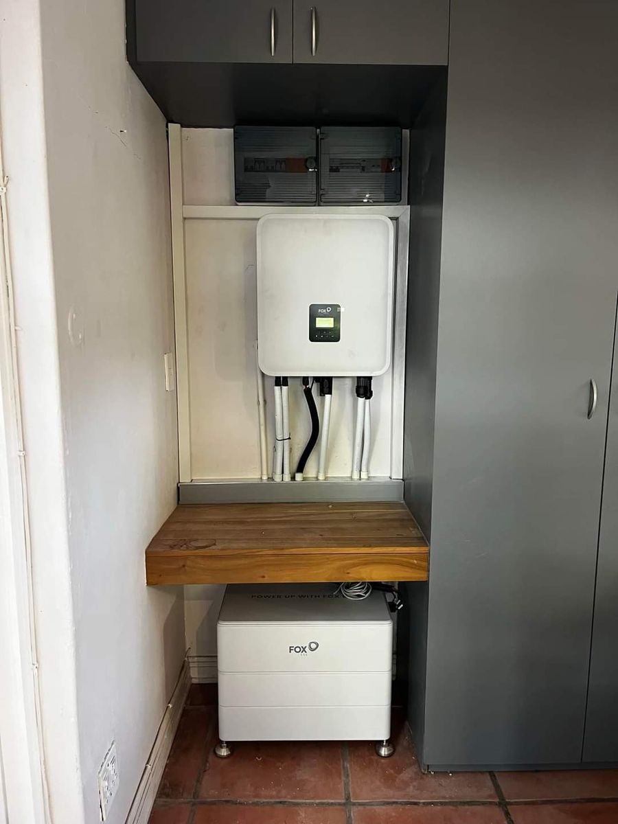 Inverter and battery fitted in a cupboard nook