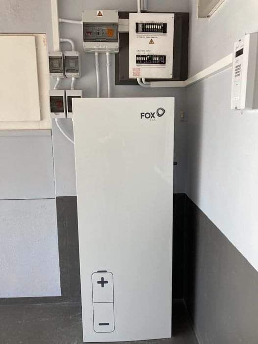 Hybrid inverter and battery tower installed on a wall