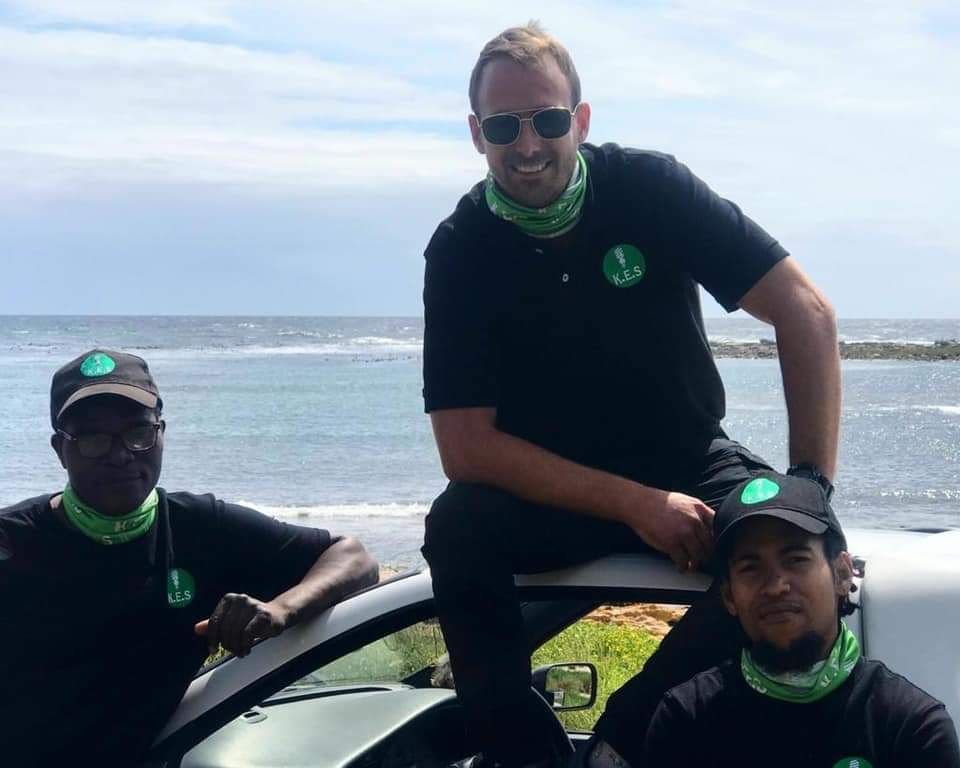 The K.E.S team on their bakkie by the sea